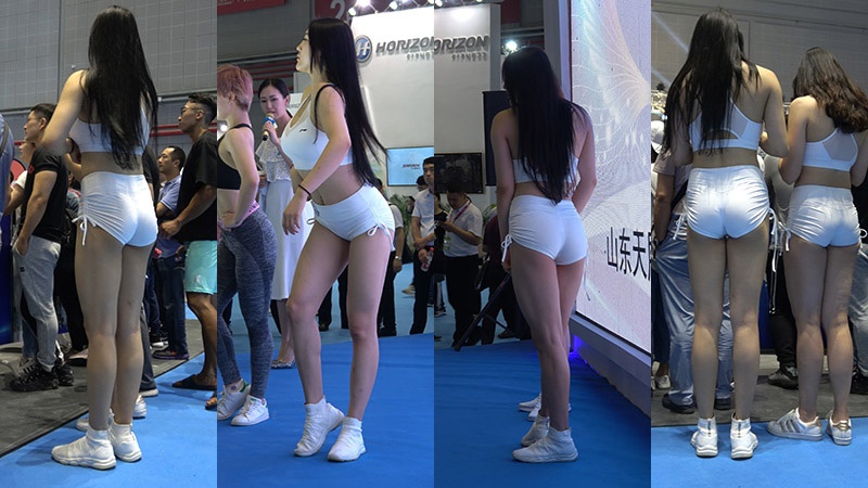 健身器材展会白色热裤翘臀美女